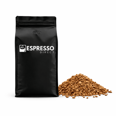 Black bag of freeze dried coffee with espresso direct logo on the bag, pile of freeze dried coffee next to the bag